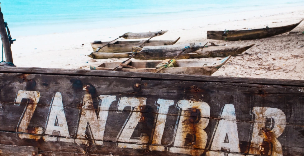 Best things to do in Zanzibar — turquoise Indian Ocean waters, white sand beach and traditional dhow