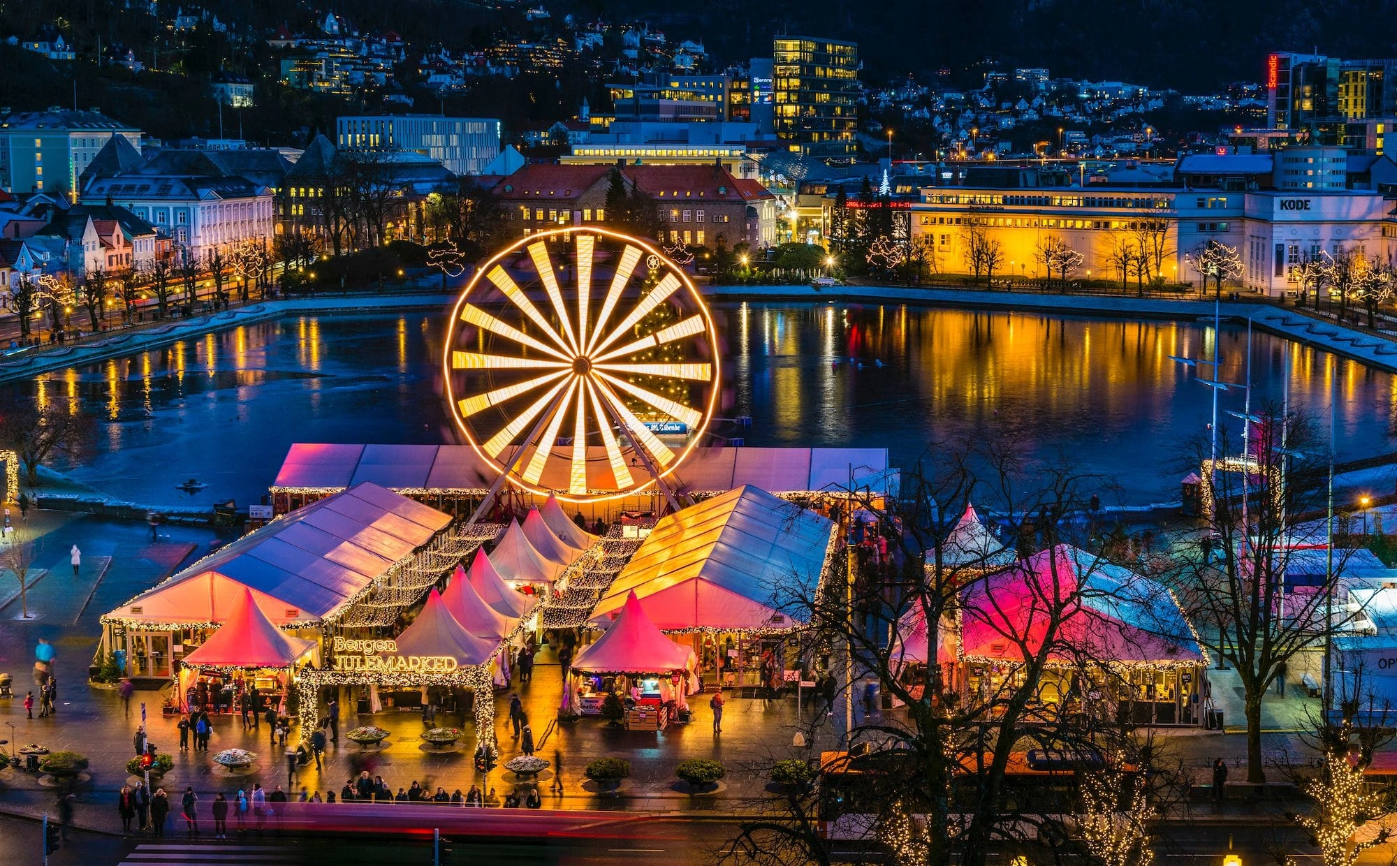 Tromsø Christmas Market in winter with festive lights, snow and Arctic city buildings